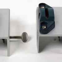          two clamps for attaching top horizontal bar to drafting board
   