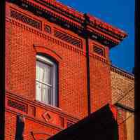          Color slide of detail view of cornice, dentils, brick friezes and arched window heads at 103 9th on the SW corner with Washington picture number 1
   