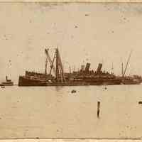 Sepia-tone photo of the S.S. Bremen & S.S. Main, Weehawken Cove after the Hoboken pier fire, ca. June 30, 1900.