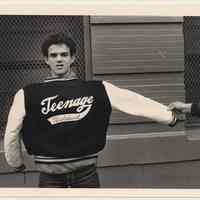 B+W photo of Frank Nunez with lettered jacket, 4th & Garden Sts., Hoboken, n.d, ca. 1983-1988.