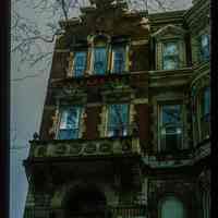          Color slide of eye-level view of brownstone façade showing portico, balconet and bracketed pediments at 925 Hudson between 9th & 10th picture number 1
   