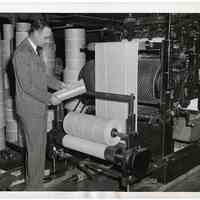 B+W photo of government inspector looking at ration book leaves being printed at Autographic Register Co. plant, 10th & Clinton Sts., Hoboken, Dec. 15, 1942.