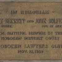 Bronze plaque: In Memoriam. Harry Bennett, Clerk & John Solferino, Sgt. at Arms, ...Service in the Hoboken District Court. Hoboken Lawyers Club, Nov. 21, 1939.