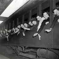 B+W photo of men on train at Lackawanna Terminal departing for Portland, Ore., shipyard work, Hoboken, Sept. 26, 1942.