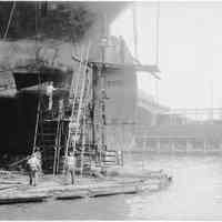 B+W photo of steerage repair to an unknown ship in a dry dock south of the Lackawanna Ferry Terminal, Hoboken, no date, ca. 1922-1930.