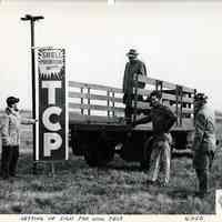 B+W photos, 2, of wind test of spinning sign, at Teterboro Airport by United States Testing Co., Hoboken, N.d., ca. 1960s-1970s.