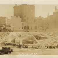 Sepia-tone photo of progress on foundation construction on the site for the Fabian Theatre, Newark & Washington Sts., Hoboken, Jan. 16, 1928.