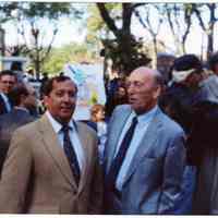 Digital image of color photo of Steve Cappiello (right) at event in Columbus Park, Hoboken, Oct. 12, 1992.