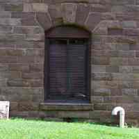          48: ground level window, west facade, north wing, third south from 1st St.
   