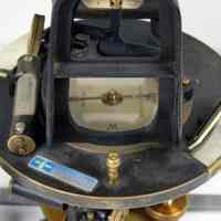          right detail horizontal limb; SD State Univ label; vernier & reflector
   