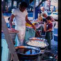 Color slide of a food stall at a street fair.