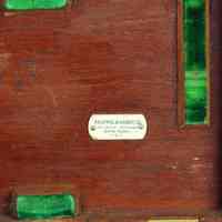          detail K&E plate; note penciled stock number to left & near right hinge
   