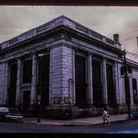 Color slide of eye-level view of front and side facades of the Jefferson Trust Company building at 313 1st on the SE corner of 1st and Clinton occupied by G&S Coat Company