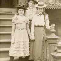 Sepia-tone photo of three young women on front steps (716 Bloomfield St.?), Hoboken, June 1900