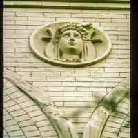 Color slide of close-up view of roundel on the façade of the Columbia Club at 1101 Bloomfield on the corner of 11th and Bloomfield