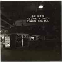 B+W photo of a neon sign, Buses Direct to Times Sq., N.Y., north end concourse, Lackawanna Terminal, Hoboken, no date, [1976].