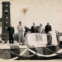 B+W photo of ceremony with John J. Grogan et al aboard a ship, probably docked in Hoboken, no date, ca. 1953-1959.