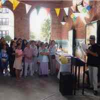 Color photo of party in Hoboken Historical Museum walkway celebrating the publication of Tom Olivieri oral history chapbook, May, 2005.