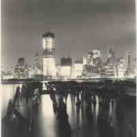 B+W photo of night view of World Trade Center towers under construction seen from Jersey City, n.d., ca. 1970.