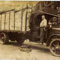 Digital print of sepia-tone photo of Gatti Paper Stock Corp. truck loaded with scrap paper, Hoboken, n.d., ca. 1920