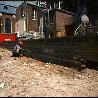 Color photo of construction steel that has arrived on the site of the north wing of Saint Mary Hospital, Hoboken, May 1976.