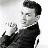 Black-and-white photo of a young Frank Sinatra in a dark jacket & tie, no place, no date, ca. 1945.