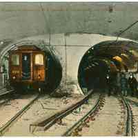          Digital image of Hudson & Manhattan R.R. postcard titled: View in the Hudson & Manhattan R.R. Company's Tunnel under the Hudson River. No date, ca. 19 picture number 1
   