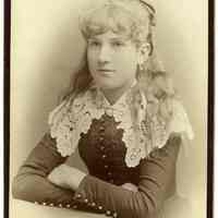 Cabinet photo of girl posed in photo studio, Hoboken, n.d., ca. 1880-1885.