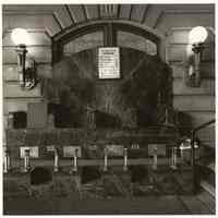 B+W photo of the shoeshine stand inside the main waiting room, Erie Lackawanna Terminal, Hoboken, no date, [1976].