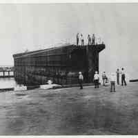          photo 1: floating gate of graving dock being positioned
   