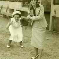          4, image: Grace Carey (at bat); Sally Vasmik (as catcher); spring training
   