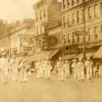 Digital image of photo of the Hoboken Playgrounds Field Band marching in 300 block, Washington St., Hoboken, no date, probably 1928.