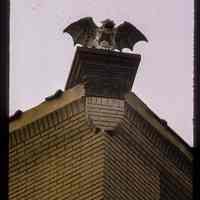 Color slide of close-up front view of gargoyle on a building on Jefferson and 4th