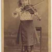 Cabinet photo of Fred. Weisenbach ca. 3-5 years old with violin in photo studio, Hoboken, n.d., ca. 1880-1892.