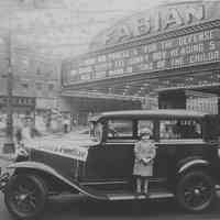 Sepia-tone photo of Fabian Theatre with automobile & girl, Washington St. at Newark St., Hoboken, n.d., ca. 1930.