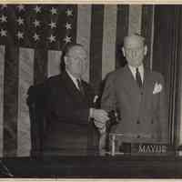 B+W photo of Frank Hague (right) handing gavel to Frank Hague Eggers, Jersey City, 1947