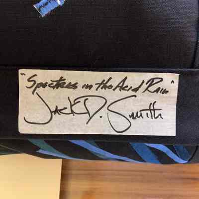 Label titled "Spectres in the Acid Rain" signed by Jack D. Smith