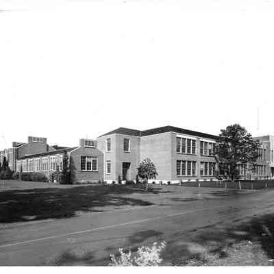Left side of the front street view of Clover Park High School on an overcast day