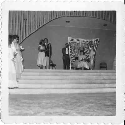 PLC student sings duet at Tillicum Pageant in front of court and emcees