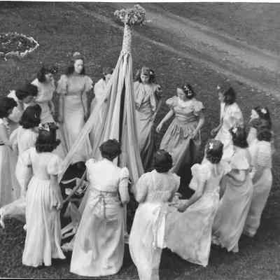 Girls close to Maypole picking up strands at Vistiation Villa