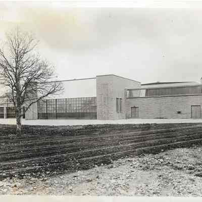 North elevation showing hangar doors leading to future landing field which is only a tilled dirt field