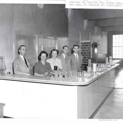Posing behind counter of Clover Park Milk Bar - Mr. Hudtloff, Mrs. Burney, Mgr., Mrs. Mann, Mr. Tethrow, Mr. Fotheringill