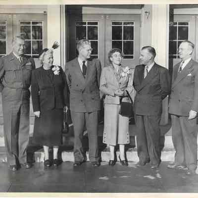 A. G. Hudtloff and four others staring at a confident Ruth Bethel while standing in front of Clover Park Jr-Sr High School 1948