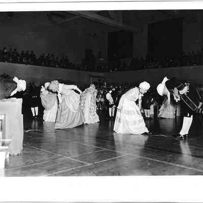 Children bowing in period costumes in the middle of Clover Park 1976 Bicentennial assembly