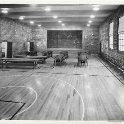 Empty gymnasium with tables and chairs to the left at Lakeview Elementary School