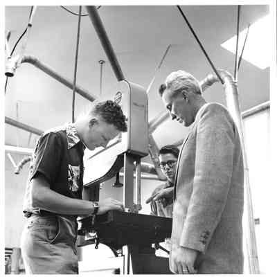 Hudtoff Junior High student working with bandsaw under supervision