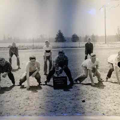 Navy Base School Intramural Champions in football positions outside