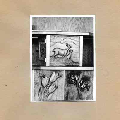 Carvings of tulips, roses, and a doe and fawn from Wood Carving Class Exhibit 1942