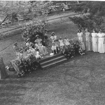 May Queen & Court with other girls standing to either side of dias
