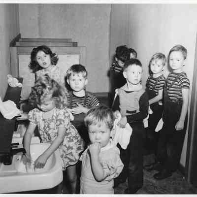 Children washing up at sinks